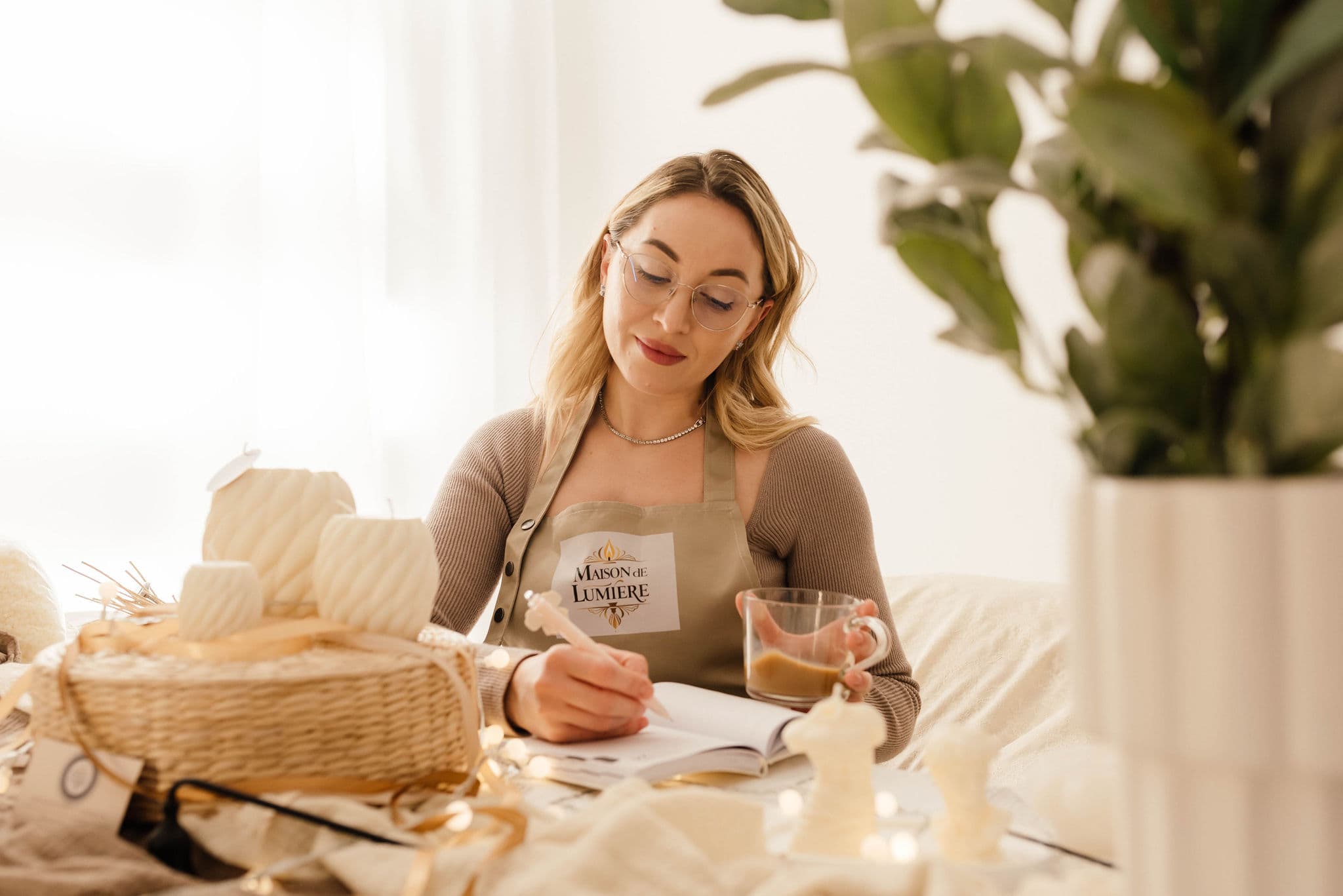 Mihaela handcrafting Maison de Lumière candles in the studio